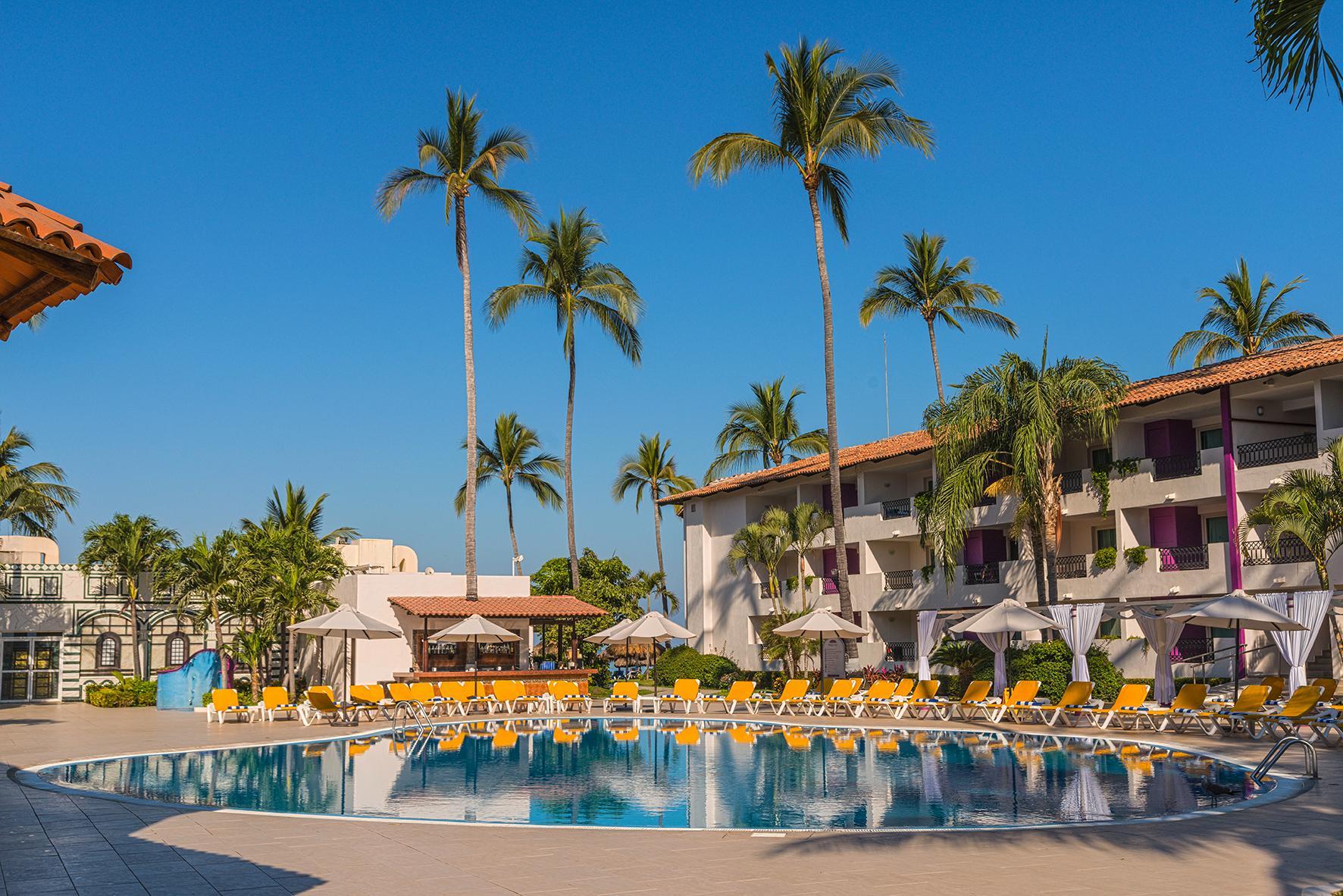 Crown Paradise Club Puerto Vallarta all-inclusive resort with beachfront pools, waterslides, and family activities on Banderas Bay.