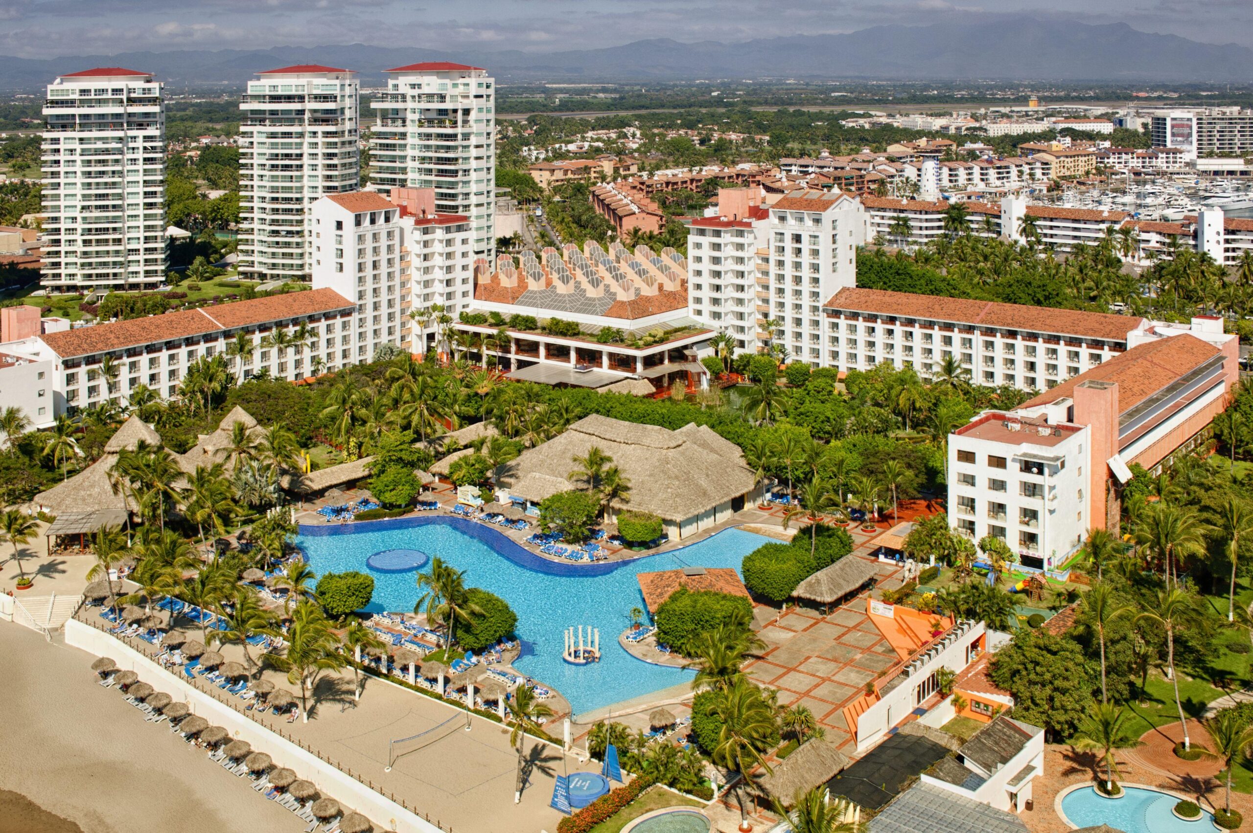 Meliá Puerto Vallarta All Inclusive beachfront resort with lush gardens, pools, and family amenities in Marina Vallarta.