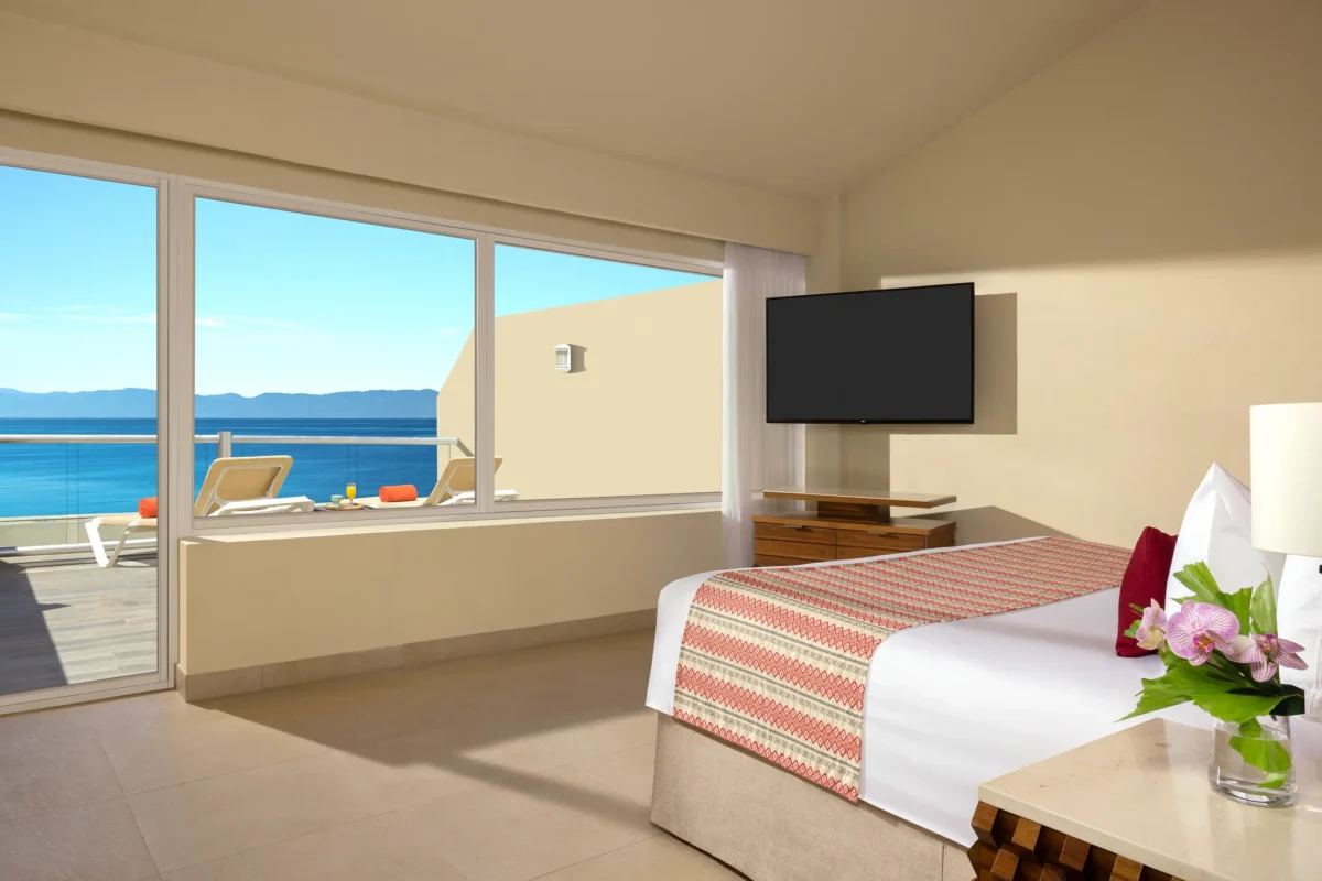 Sun Club Romantic Ocean Front suite with king bed and oceanfront views at Sunscape Puerto Vallarta Resort & Spa.